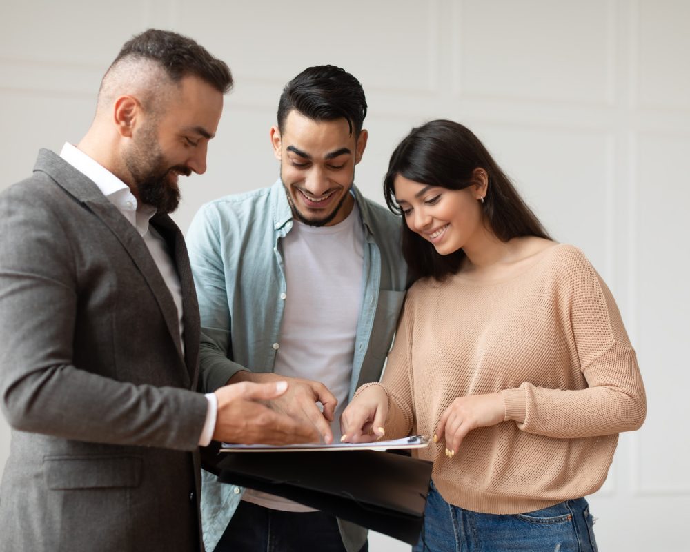 couple-buying-new-apartment-house-agent-showing-documents-blueprints.jpg couple-buying-new-apartment-house-agent-showing-documents-blueprints.jpg